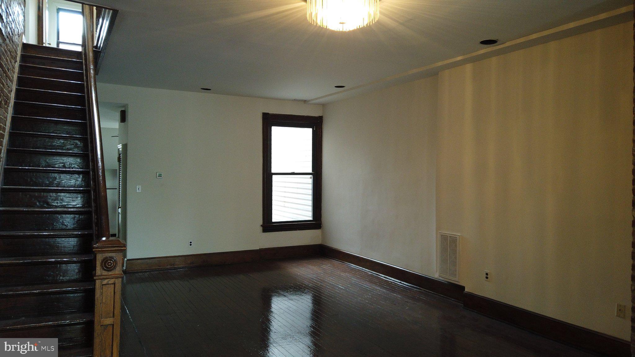 604 9th Street Northeast Washington, DC 20002 - Photo 28 of 28 Spacious room with elegant staircase.
