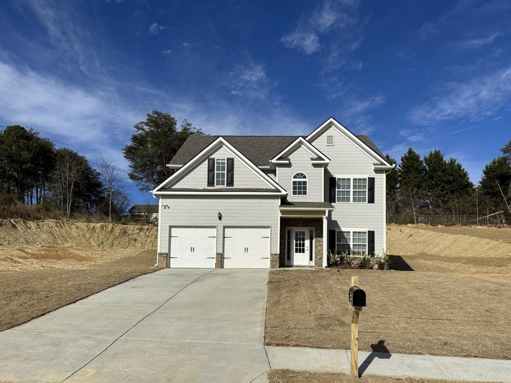 a view of a house with a yard
