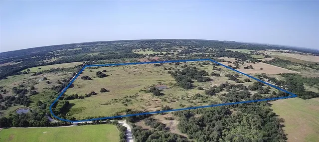 an aerial view of house with yard