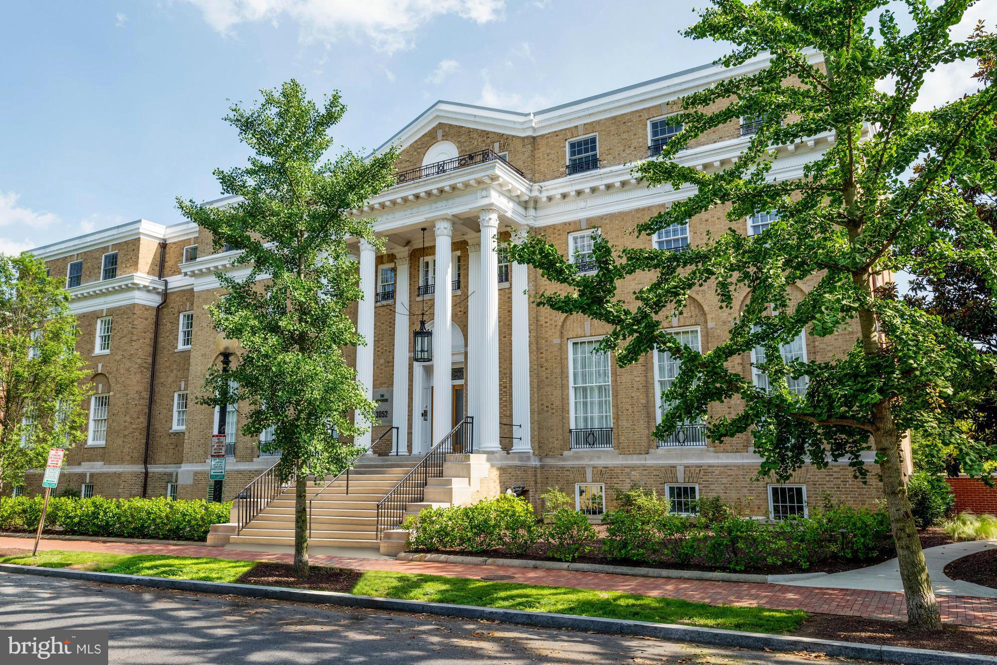 3052 R Street Northwest, Unit 304 Washington, DC 20007 - Photo 18 of 19 a front view of a house with a garden