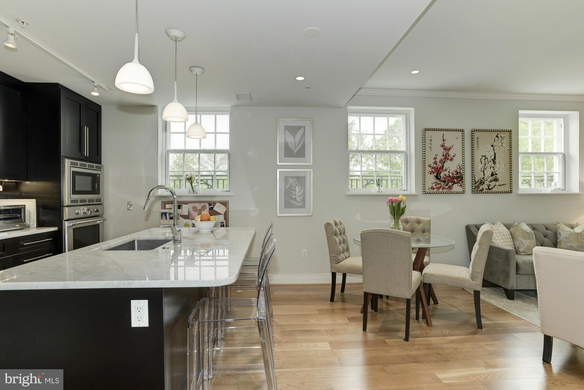 3052 R Street Northwest, Unit 304 Washington, DC 20007 - Photo 5 of 19 a view of a dining room with furniture and window
