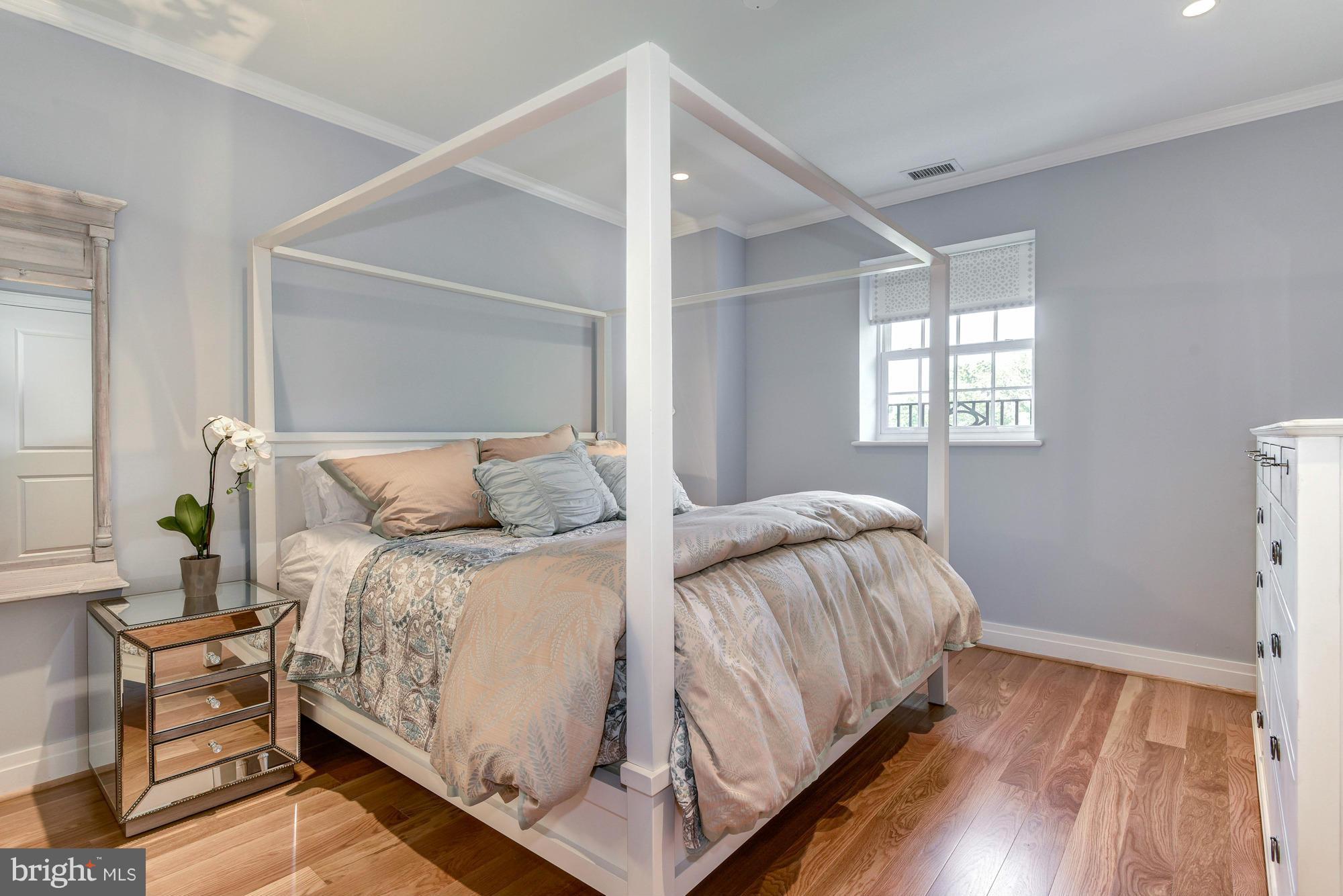 3052 R Street Northwest, Unit 304 Washington, DC 20007 - Photo 6 of 19 a bedroom with a bed and window