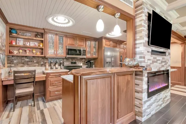 a bathroom with a granite countertop bathtub sink mirror vanity and toilet