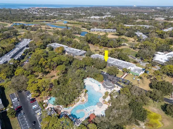 a living room with a fireplace and a flat screen tv