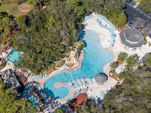 a spacious bedroom with a large bed and a flat screen tv