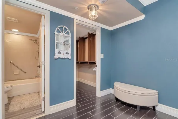 a view of an entryway with wooden floor