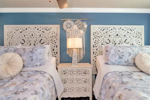 a view of a balcony with two chairs and a table