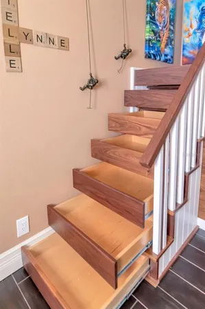 a living room with fireplace furniture and a flat screen tv