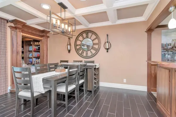 a view of a dining area with furniture and a clock