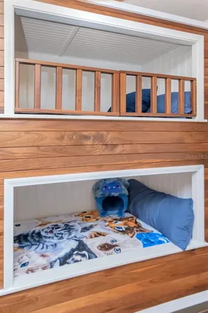 a kitchen with stainless steel appliances granite countertop a refrigerator a oven and a sink with granite countertops