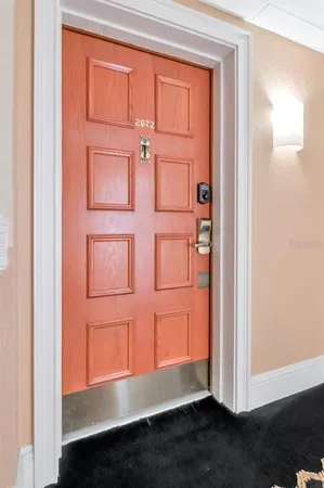 an aerial view of residential houses with outdoor space and swimming pool