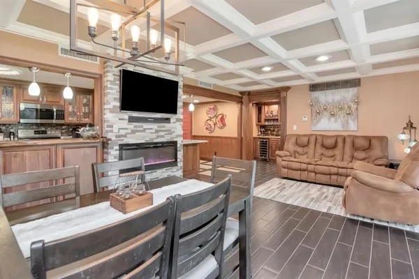 a living room with fireplace furniture and a flat screen tv