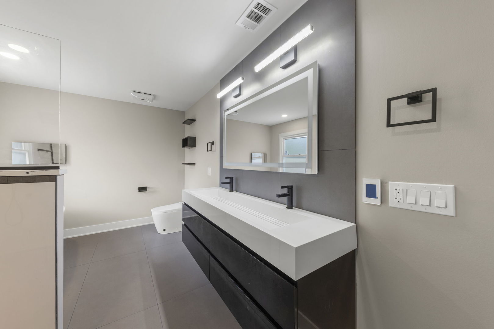 625 Edward Road Naperville, IL 60540 - Photo 27 of 47 a bathroom with a sink and a mirror