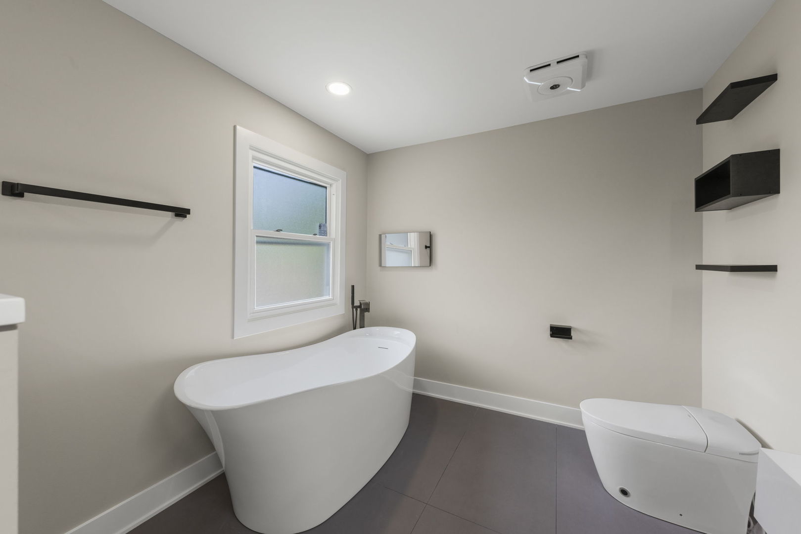 625 Edward Road Naperville, IL 60540 - Photo 28 of 47 a bathroom with a white tub shower and sink