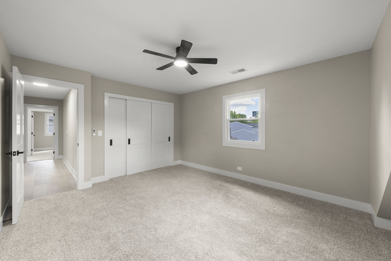 625 Edward Road Naperville, IL 60540 - Photo 33 of 47 a view of a livingroom with a ceiling fan and window