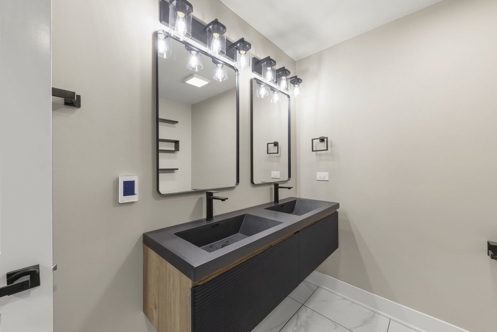 625 Edward Road Naperville, IL 60540 - Photo 35 of 47 a bathroom with a sink and a mirror
