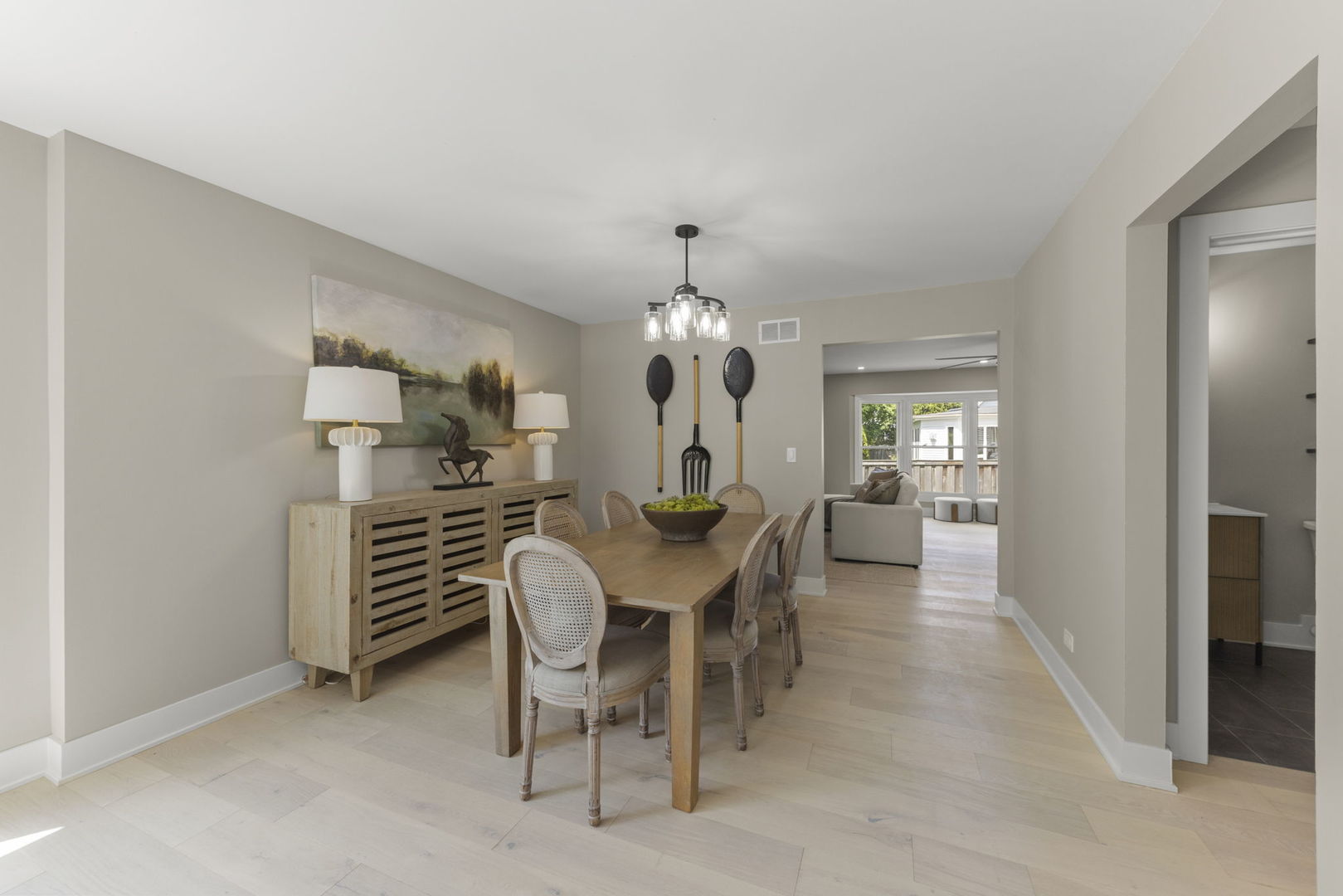 625 Edward Road Naperville, IL 60540 - Photo 9 of 47 a dining room with furniture a chandelier and window