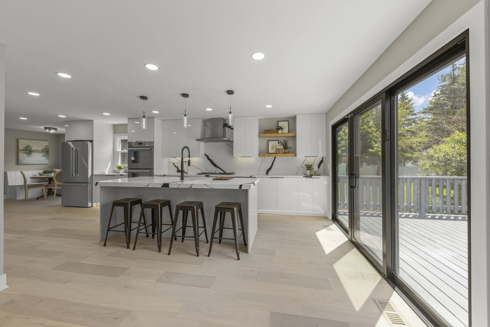 625 Edward Road Naperville, IL 60540 - Photo 10 of 47 a dining hall with stainless steel appliances granite countertop a refrigerator a sink a dining table and chairs with wooden floor
