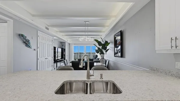 a kitchen with a sink and a refrigerator