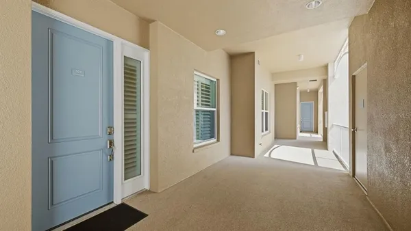a view of a room with an empty space and entrance