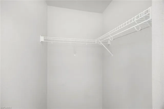 a bathroom with a sink vanity mirror and toilet