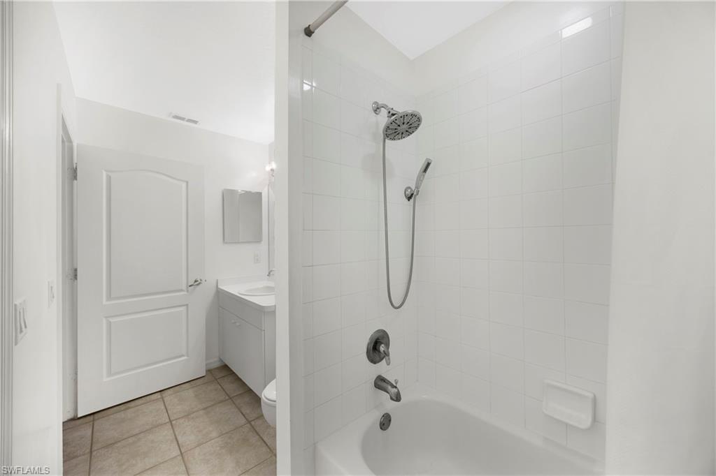 8550 Kingbird Loop, Unit 615 Estero, FL 33967 - Photo 14 of 35 a bathroom with a bathtub and shower