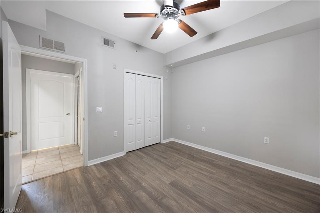 8550 Kingbird Loop, Unit 615 Estero, FL 33967 - Photo 17 of 35 wooden floor in an empty room