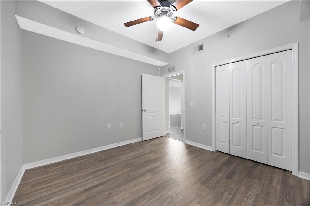 8550 Kingbird Loop, Unit 615 Estero, FL 33967 - Photo 18 of 35 a view of an empty room and wooden floor