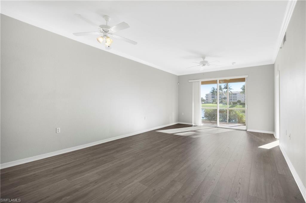 8550 Kingbird Loop, Unit 615 Estero, FL 33967 - Photo 19 of 35 a view of an empty room with wooden floor and a window