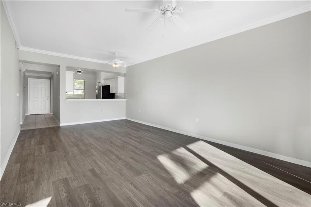 8550 Kingbird Loop, Unit 615 Estero, FL 33967 - Photo 21 of 35 a view of empty room with wooden floor