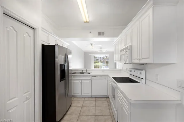 a kitchen with a sink stove and refrigerator