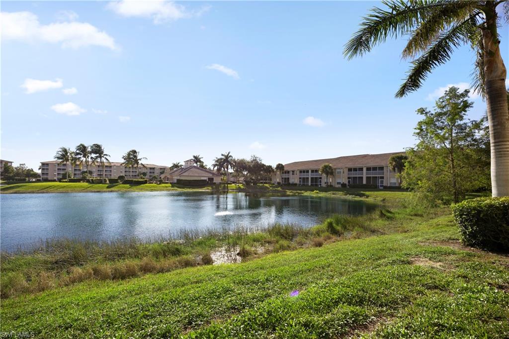 8550 Kingbird Loop, Unit 615 Estero, FL 33967 - Photo 29 of 35 a view of a lake with houses in the back