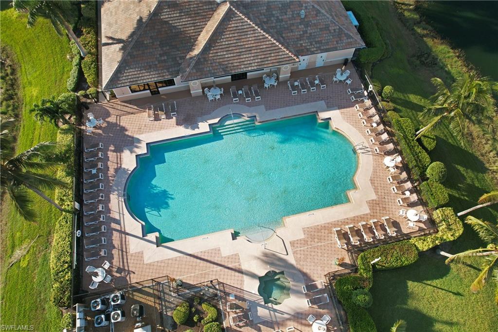 8550 Kingbird Loop, Unit 615 Estero, FL 33967 - Photo 34 of 35 an aerial view of a house with a yard and lake view