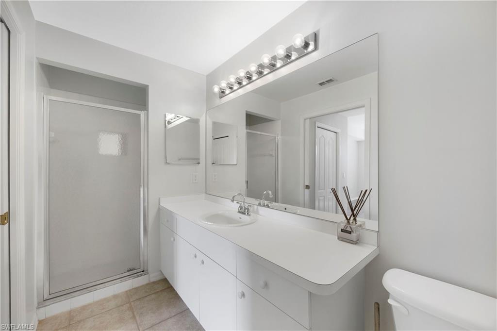 8550 Kingbird Loop, Unit 615 Estero, FL 33967 - Photo 9 of 35 a bathroom with a sink and a mirror