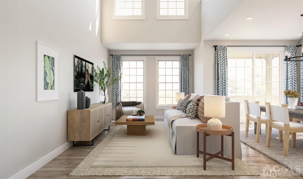 728 Station Road, Unit 524 Dunellen, NJ 08812 - Photo 7 of 11 a living room with furniture and large windows