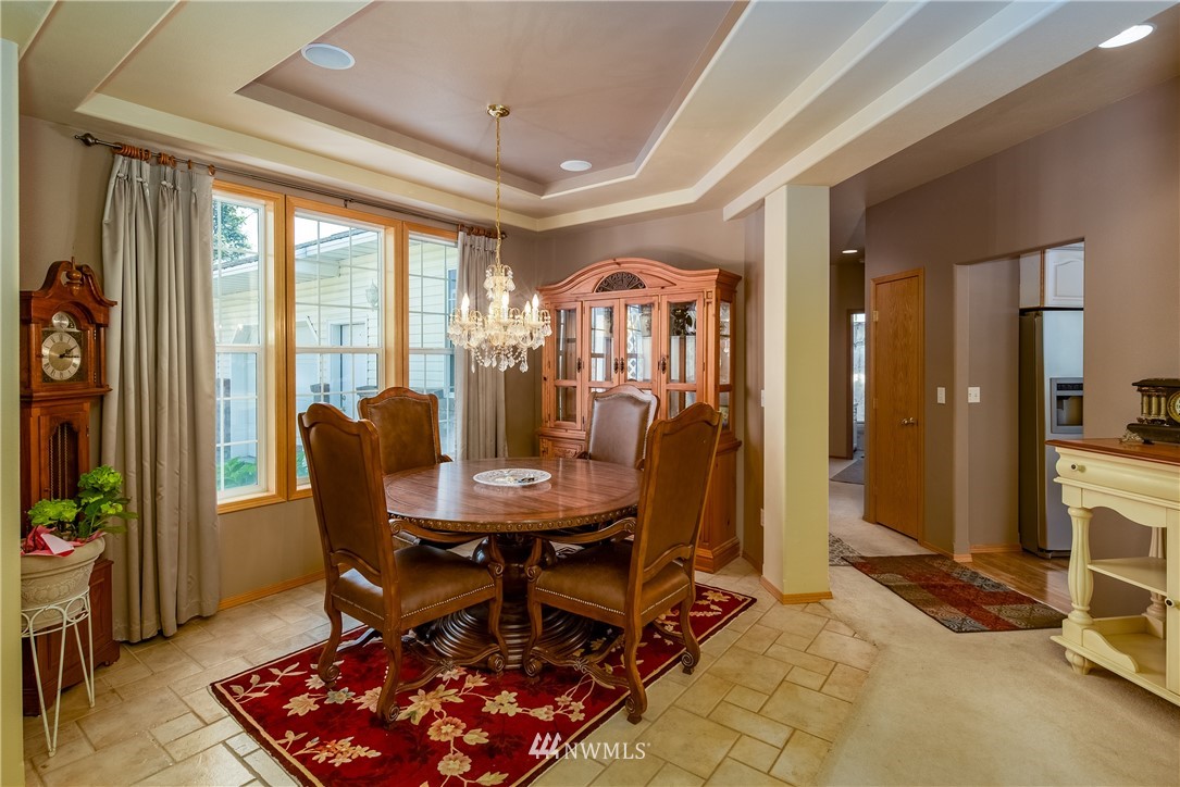 657 Williams Lake Road, Unit F Colville, WA 99114 - Photo 8 of 38 a view of a dining room with furniture and a window