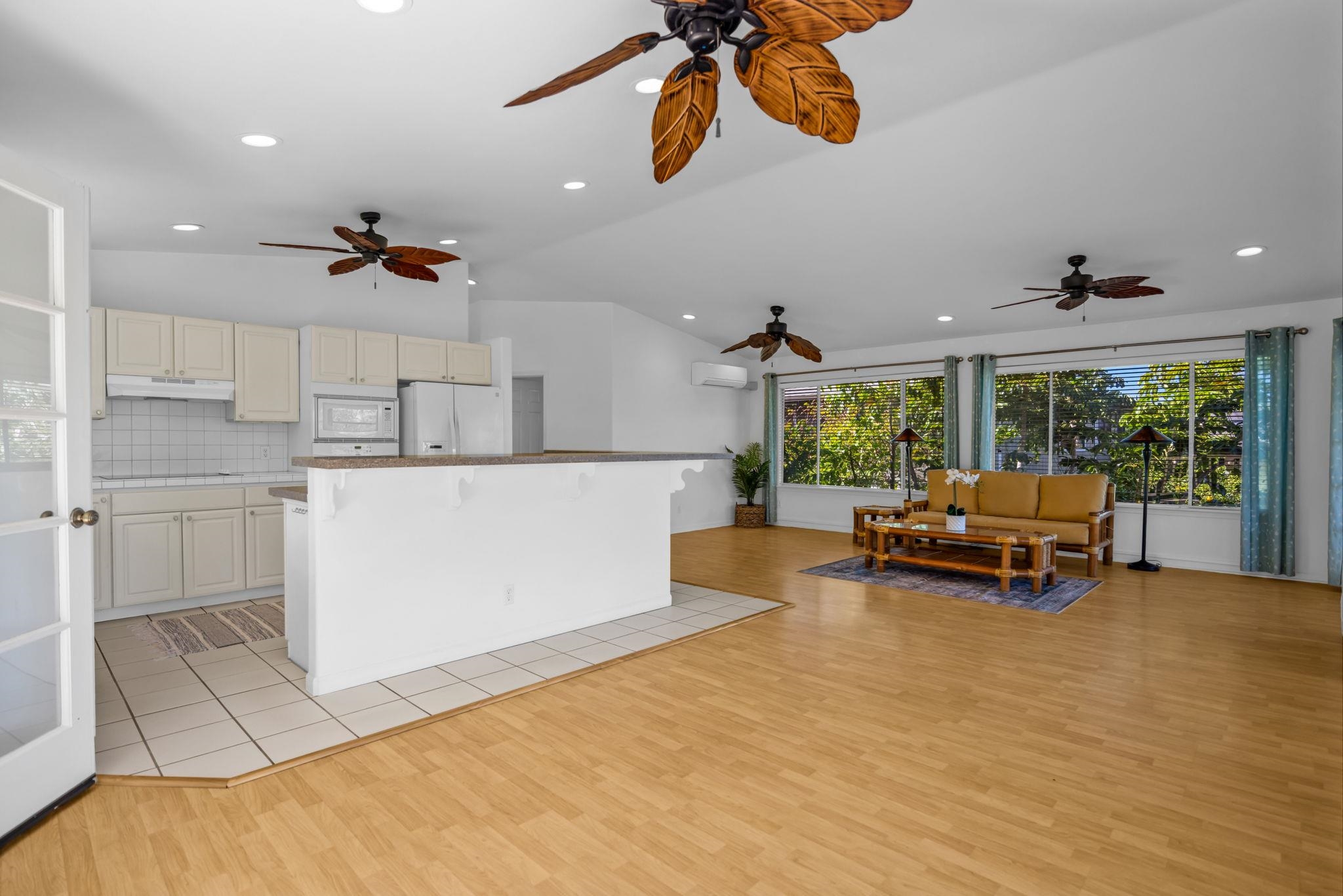 235 Keonekai Road Kihei, HI 96753 - Photo 11 of 50 a kitchen with a sink and a stove top oven
