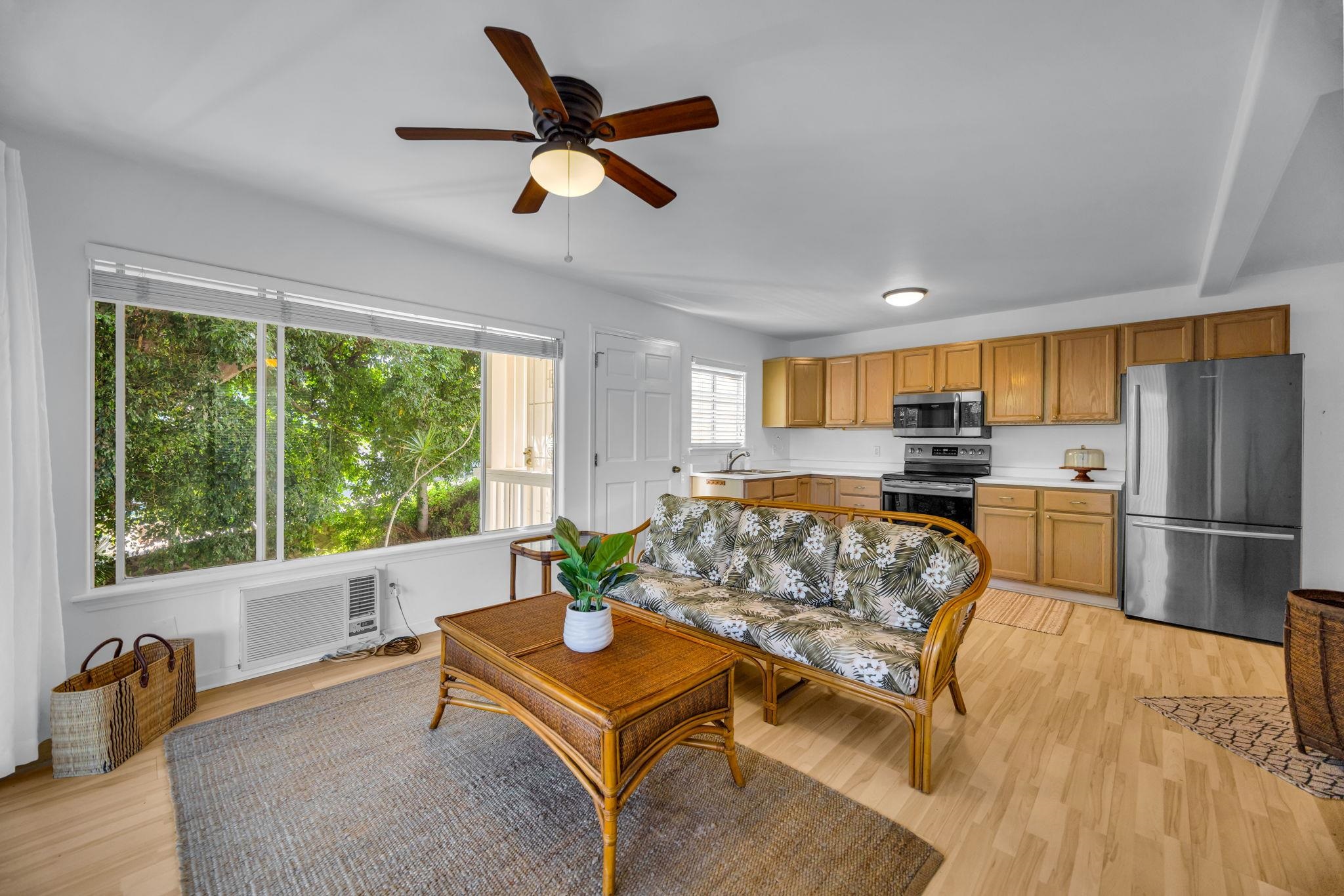 235 Keonekai Road Kihei, HI 96753 - Photo 34 of 50 a living room with furniture and a large window