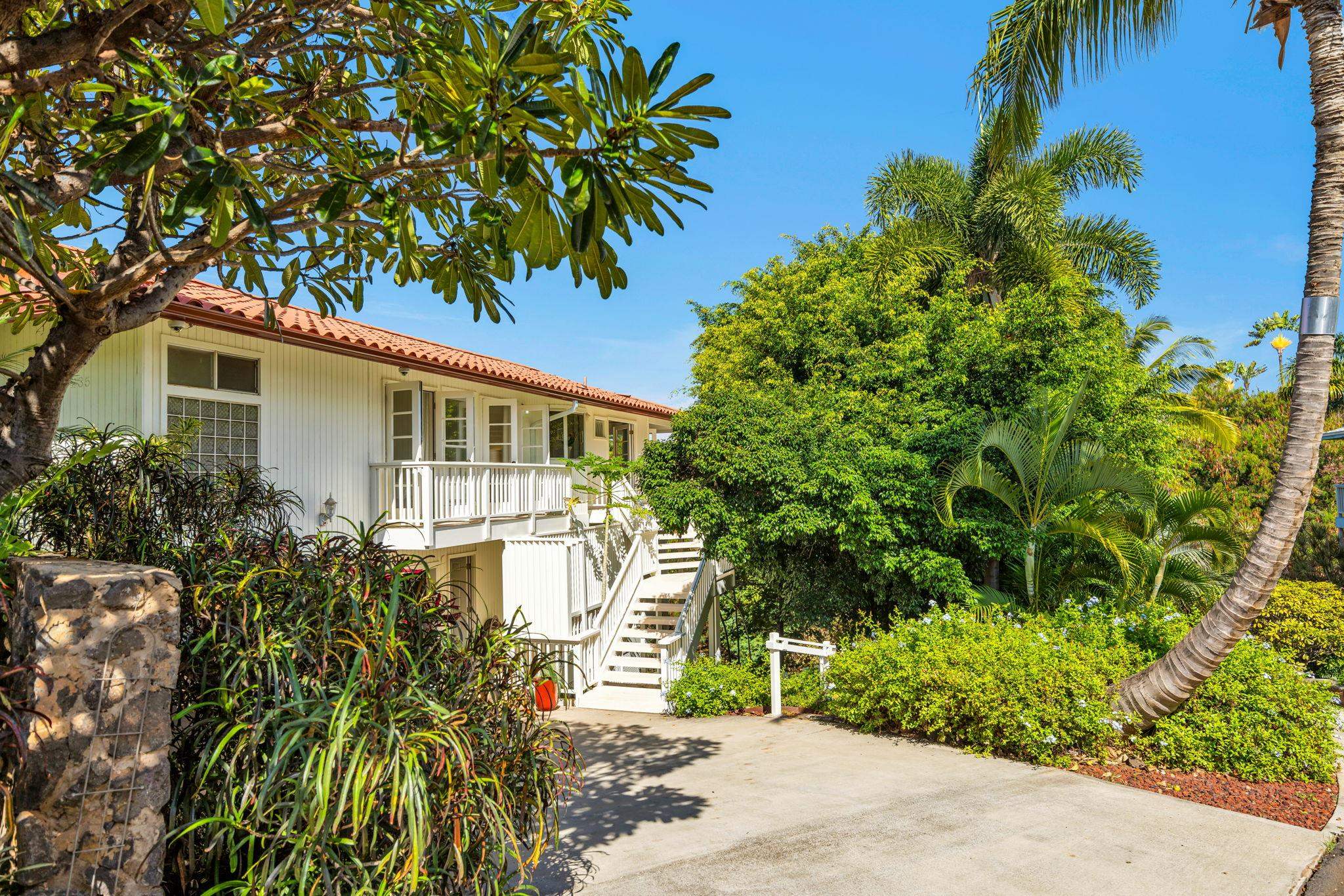 235 Keonekai Road Kihei, HI 96753 - Photo 46 of 50 a front view of a house with a garden