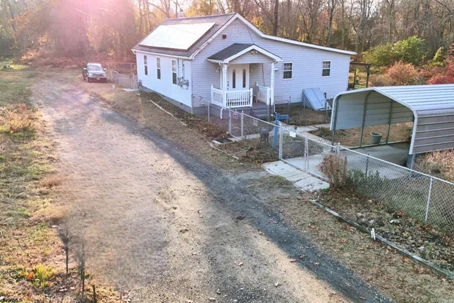 a front view of a house with yard