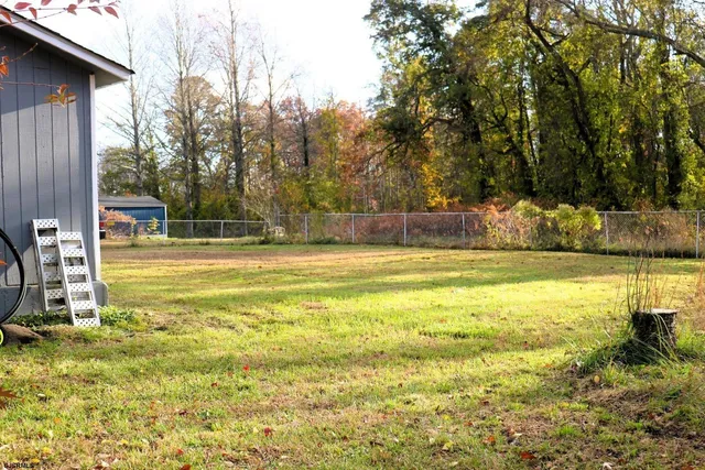 a view of a swimming pool with an outdoor space and seating area