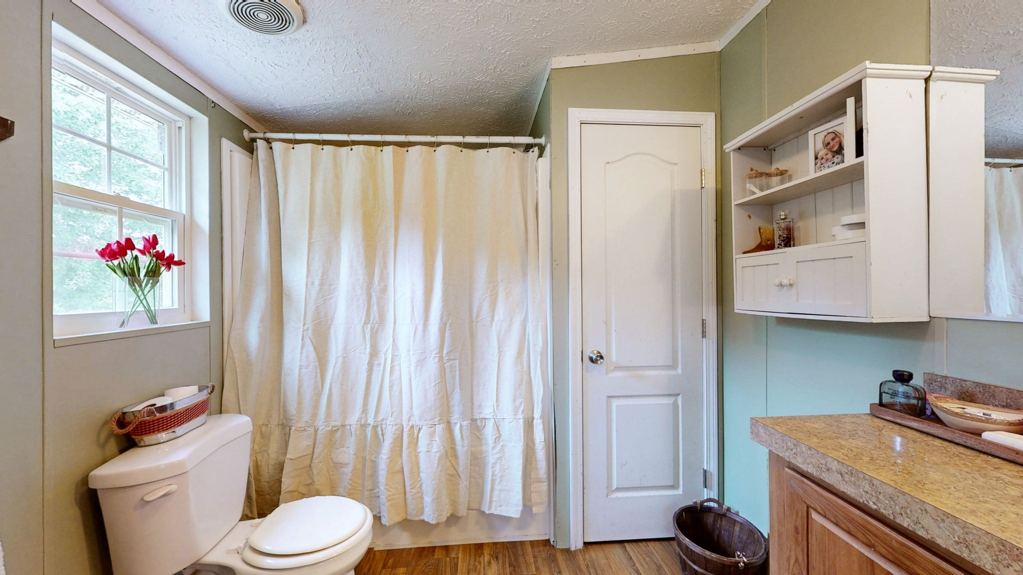 133 Cleveland Road Wartrace, TN 37183 - Photo 14 of 23 a bathroom with a granite countertop sink and a toilet