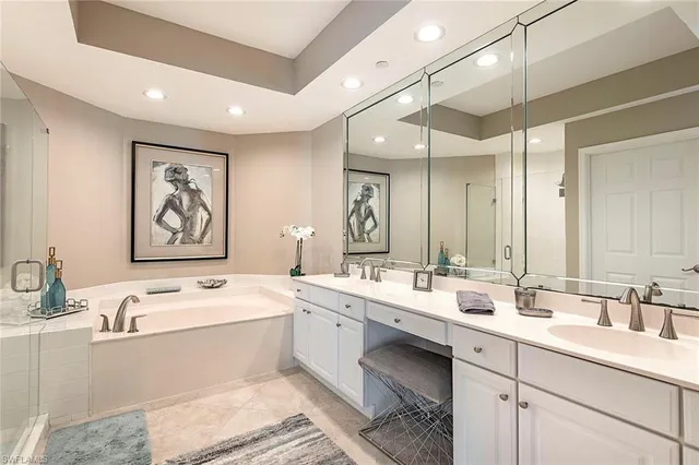 a bathroom with a double vanity sink mirror and double