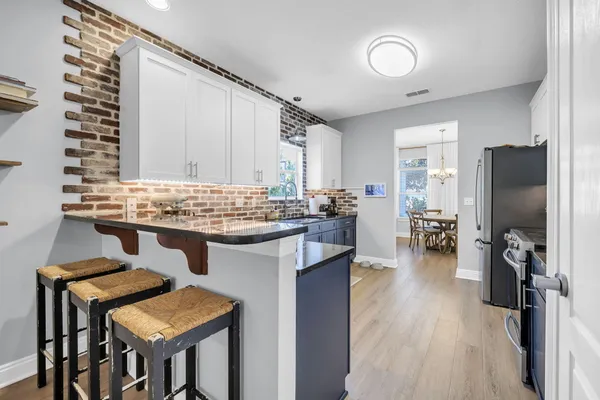 a kitchen with a table and chairs in it