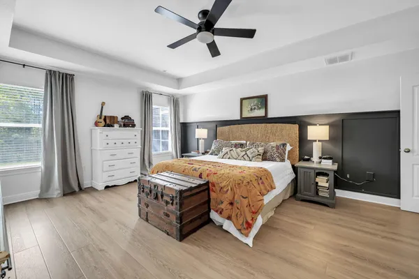 a bedroom with a bed and a dresser