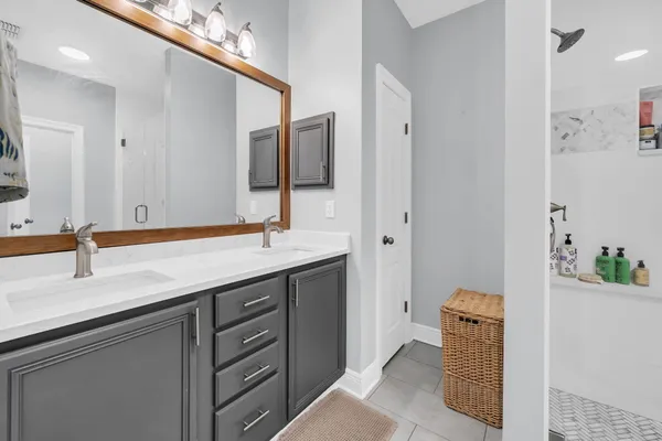 a bathroom with a sink and a mirror