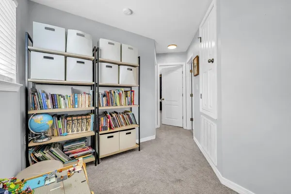 a view of room with furniture and shelf
