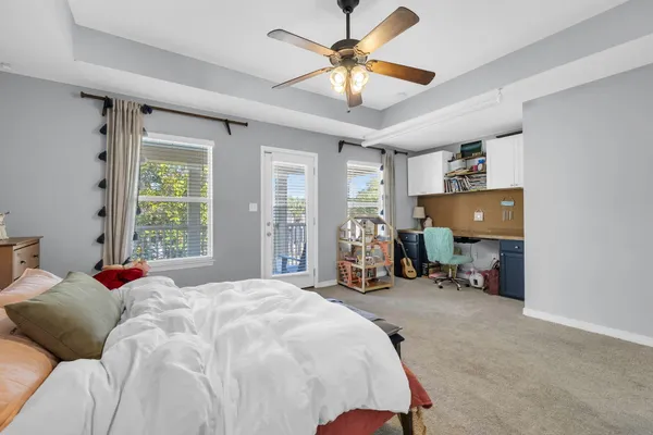 a bed room with a bed and a chair