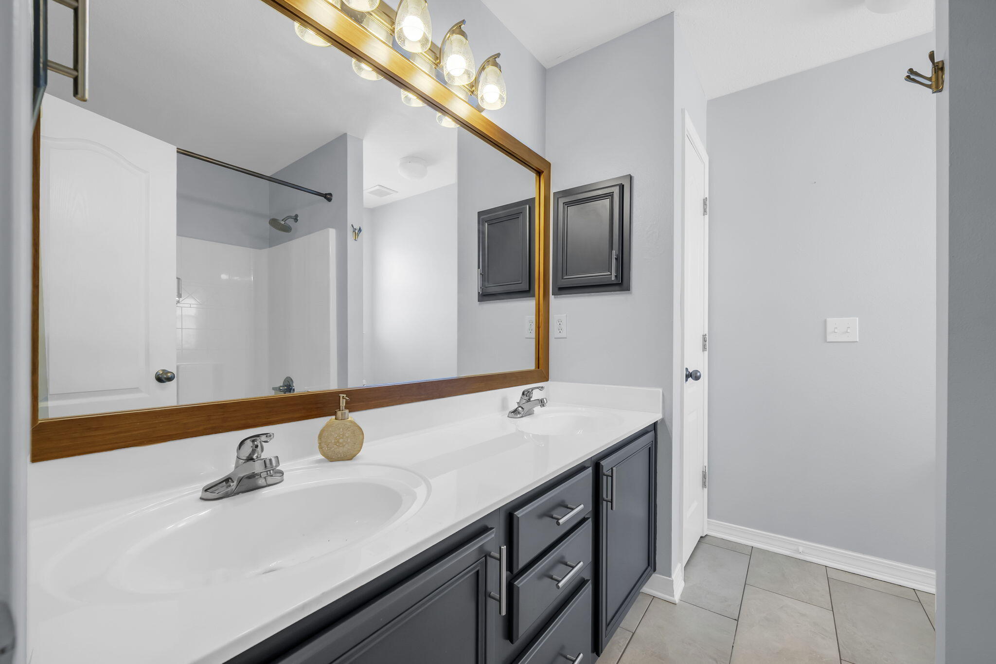 98 Bald Eagle Drive Santa Rosa Beach, FL 32459 - Photo 30 of 48 a bathroom with a sink and a mirror