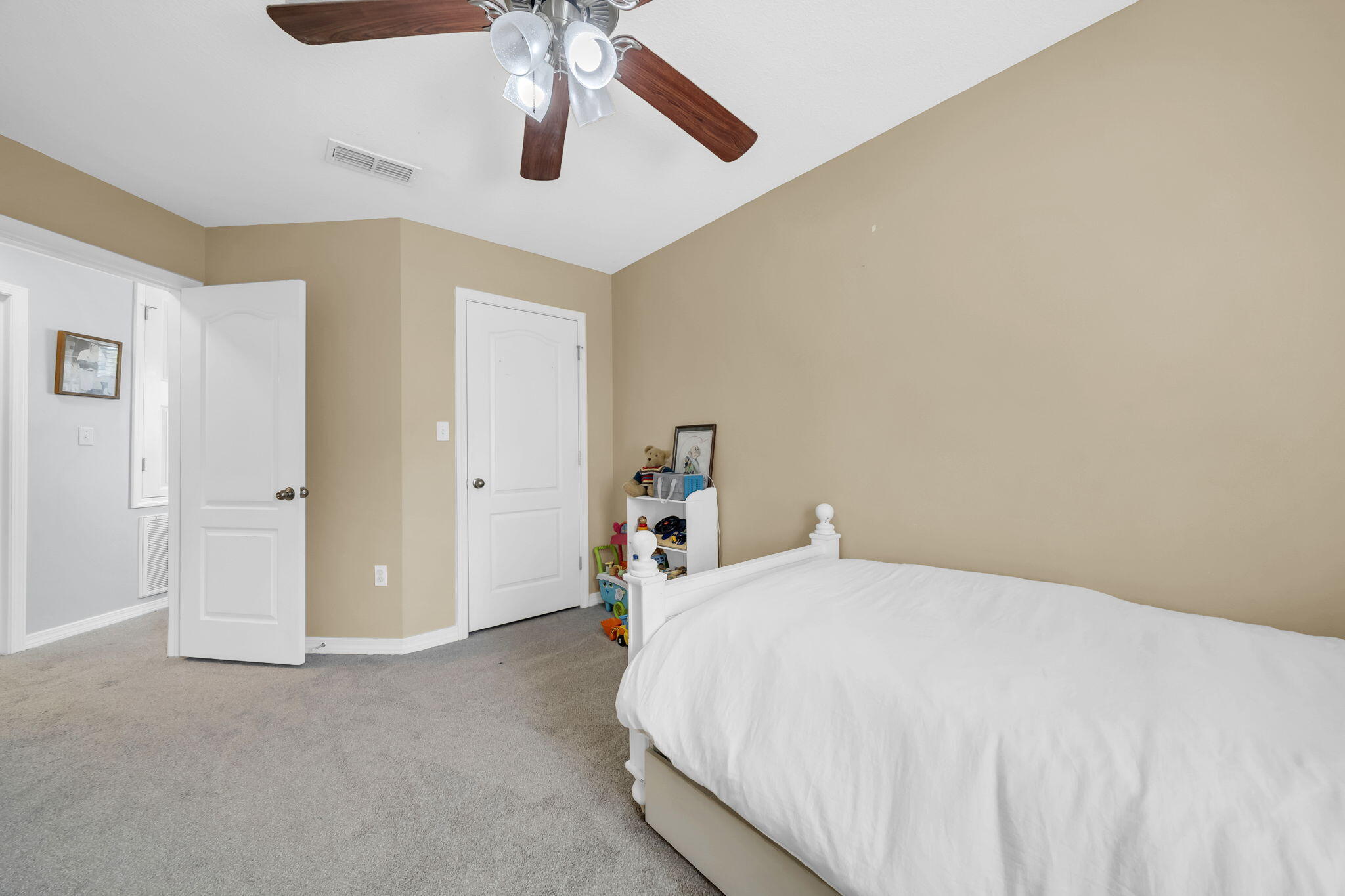 98 Bald Eagle Drive Santa Rosa Beach, FL 32459 - Photo 38 of 48 a bedroom with a bed and a chandelier